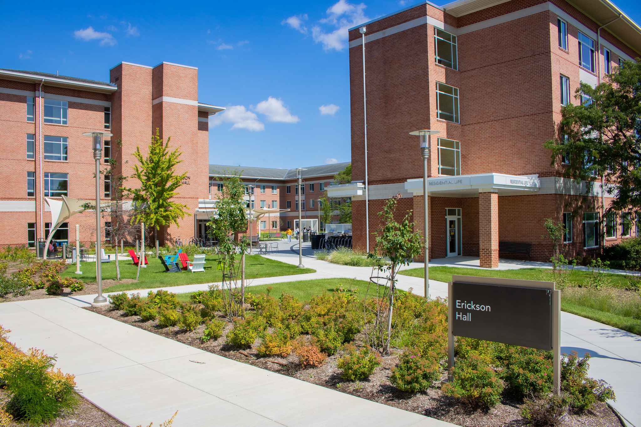 Erickson Hall Entry Sign and Plantings with sidewalk to amenity areas