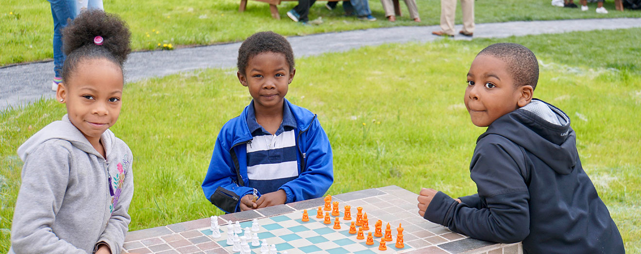 Children playing chess at Baltimore park