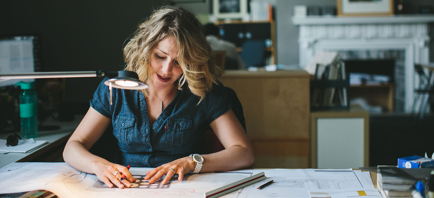 Alice Jones drawing at her desk