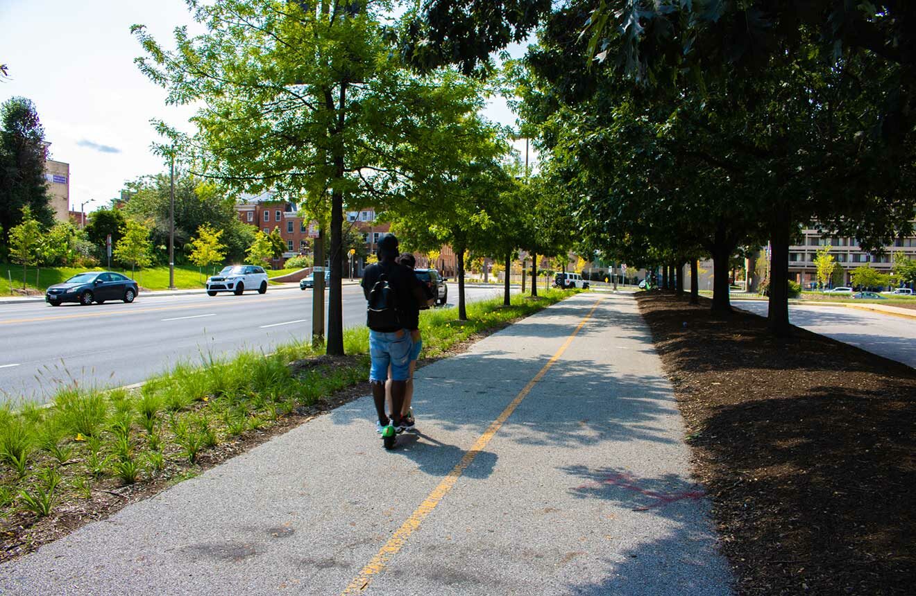 Person riding scooter down new bike lane